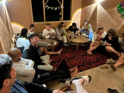 a group of people sitting in a room at Rose Garden Dades in Kalaat MGouna