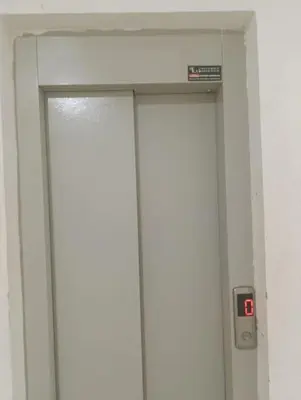 a door in a bathroom with a sign on it at iliy House in Mrhila