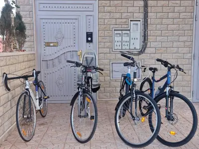 three bikes parked in front of a building at My HOME in Tinerhir