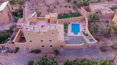 an aerial view of a house with a swimming pool at Kasbah Talala in Skoura