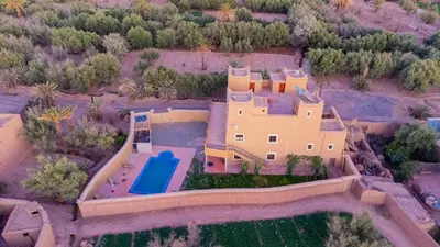 an aerial view of a house with a swimming pool at Kasbah Talala in Skoura