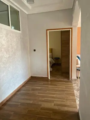 an empty room with a door open to a bedroom at حي الزهراء in Khenifra