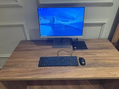 a computer monitor and a keyboard and mouse on a desk at Suite Bahiya 19 in Fès