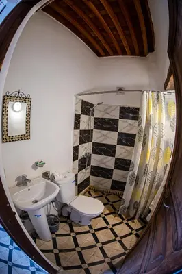 a bathroom with a toilet and a sink at Dar Fez Arinas - Rooftop View - Central Fez in Fès