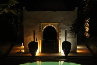 a entrance to a house with a door at night at Palais Celoa in Marrakech