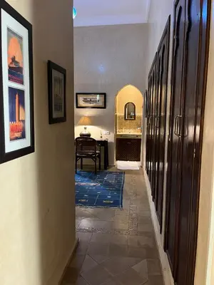 a hallway with a room with a desk and a table at Palais Celoa in Marrakech