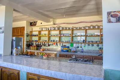 a kitchen with a counter and a counter top at lmtounipalace in Ouarzazate