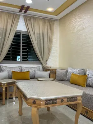 a living room with a couch and a window at Appartement fes centre in Fès