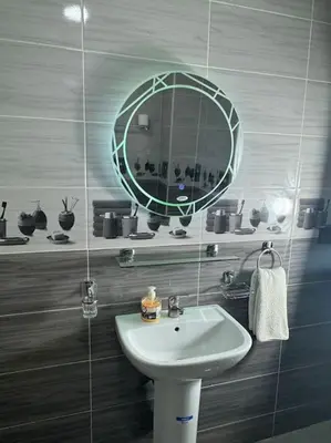 a bathroom with a sink and a mirror at Appartement fes centre in Fès