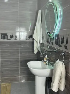 a bathroom with a sink and a mirror at Appartement fes centre in Fès