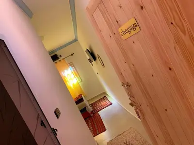 a room with a door with a sign on it at Dar Ayour Todra Gorges in Aït Baha