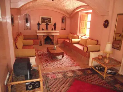 a living room filled with furniture and a fireplace at John's Place in Marrakech