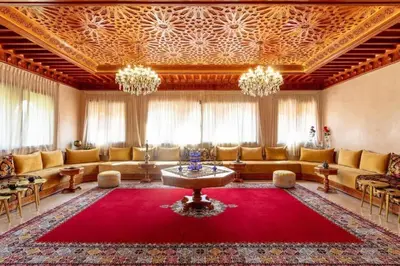 a large living room with a large red rug at Villa Lamaan - Domaine prive piscine et hammam in Douar bel Rhanodour