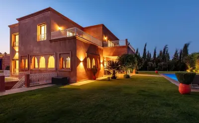 a large house with a large yard in front of it at Villa Lamaan - Domaine prive piscine et hammam in Douar bel Rhanodour