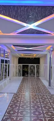 an empty room with a dance floor and lights at Superbe appartement à Meknes in Meknès