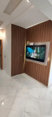 a room with a flat screen tv on a wall at Superbe appartement à Meknes in Meknès