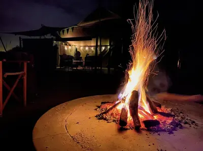 a fire pit in the middle of the night at Superides Camp in Ourika