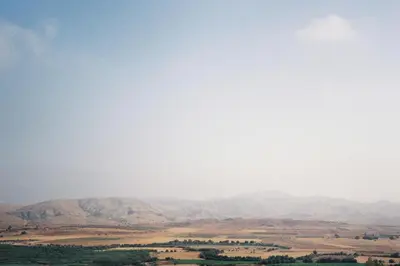 a view of a field with mountains in the background at Superides Camp in Ourika