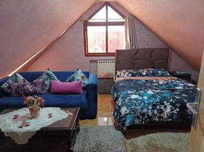 a bedroom with a blue bed and a blue couch at Lovely & Cozy Self-Contained Studio Apartment For 2 Guests Apt No 3 in Ifrane