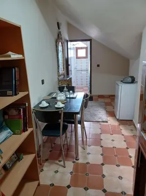a dining room with a table and chairs and a floor at Lovely & Cozy Self-Contained Studio Apartment For 2 Guests Apt No 3 in Ifrane