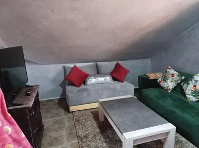 a living room with a couch and a tv at Lovely & Cozy Self-Contained Studio Apartment For 2 Guests Apt No 3 in Ifrane