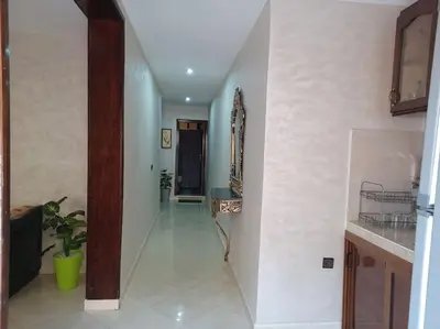 a hallway of a house with a mirror and a sink at The Orchard Cozy & Comfy Apartment 1 in Ifrane
