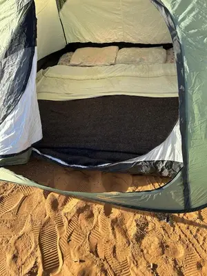 an inside of a tent in the sand at Time to Discover Wild Camp in Merzouga