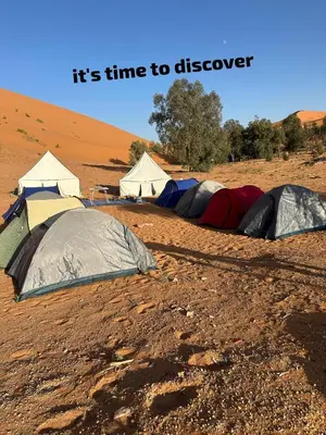 a group of tents in the desert at Time to Discover Wild Camp in Merzouga