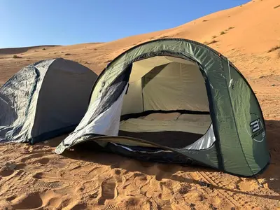 a tent in the sand in the desert at Time to Discover Wild Camp in Merzouga