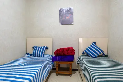 two beds sitting next to each other in a room at Bab Alas apartments N2 in Ourika valley in Ourika