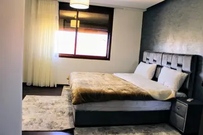 a bedroom with a large bed with a window at شقق الاسد افران in Ifrane