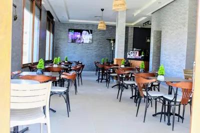 a row of tables and chairs in a restaurant at شقق الاسد افران in Ifrane