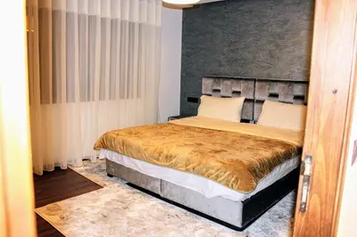 a bedroom with a large bed in a room at شقق الاسد افران in Ifrane