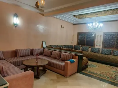 a large living room with couches and a table at séjour confort et design à Fès in Fès