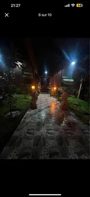 a stone walkway at night with lights on it at Soulta villa in Marrakech