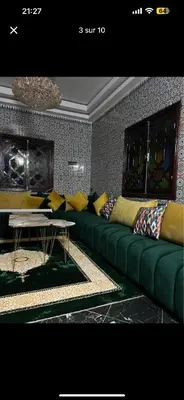a living room with a green couch and a table at Soulta villa in Marrakech
