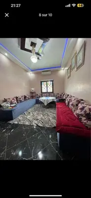 a large living room with a couch and a bed at Soulta villa in Marrakech