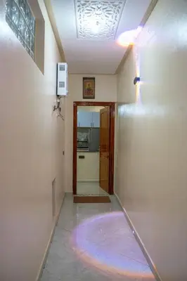 a hallway with a room with a rug on the floor at Bab Atas appartment N4 in Ourika Valley in Marrakech