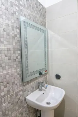 a bathroom with a sink and a mirror on the wall at Bab Atas appartment N4 in Ourika Valley in Marrakech