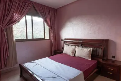 a bedroom with a bed and a window at Bab Atlas appartment N5 in Ourika valley in Aghbalou