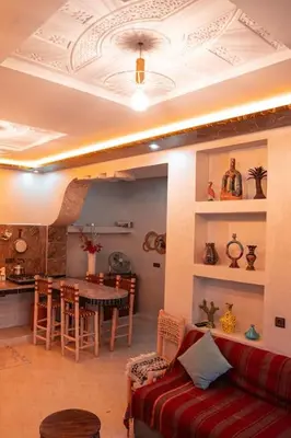 a living room with a couch and a table at Bab Atlas appartment N5 in Ourika valley in Aghbalou