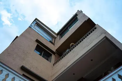 a building withwindows on the top of it at Bab Atlas appartment N5 in Ourika valley in Aghbalou