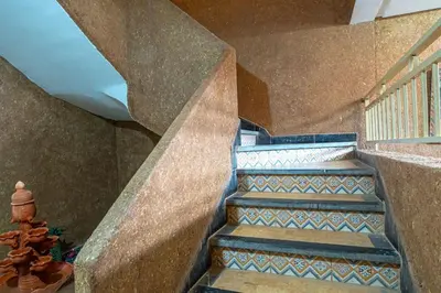 a set of stairs with blue and white tiles at Bab Atlas appartment N5 in Ourika valley in Aghbalou