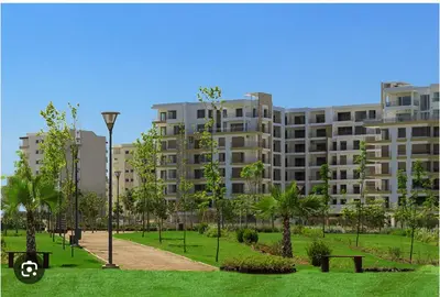 a large apartment building with a park in front of it at Luxury appartement prestigia avec wifi fibre optique in Fès
