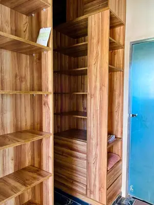 a wooden closet with wooden shelves in a room at Villa avec piscine et jardin in Marrakech