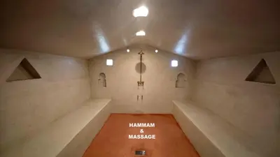 an empty room with a chandelier in a building at Lodge Hara Oasis in Agdz