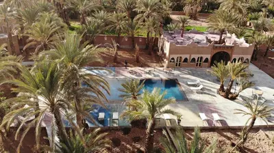 an aerial view of a resort with palm trees at Lodge Hara Oasis in Agdz