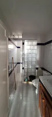 a bathroom with two sinks and a toilet in it at Quartier habri imouzzer kandar in Imouzzer Kandar