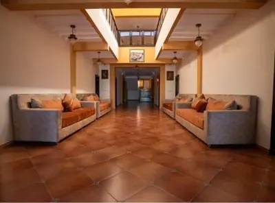 a large room with couches in the middle of it at Hotel OUM EL FADL in Fkih Ben Salah