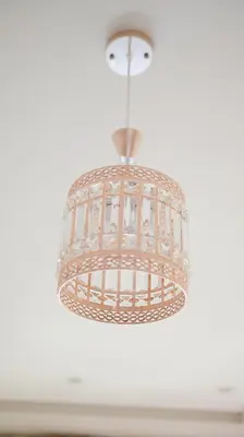 a chandelier hanging from a white ceiling at Darkoum, your apartment in fes city in Fès